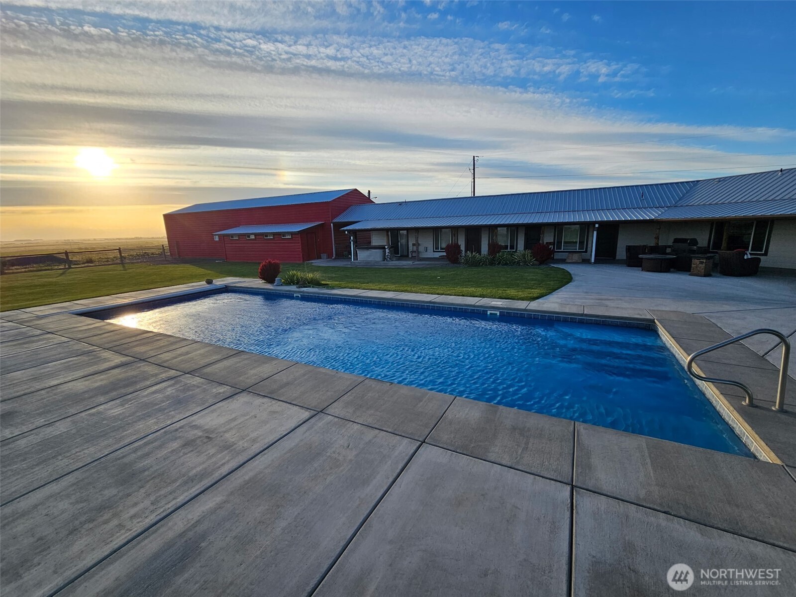 8708 Rd K Northeast Moses Lake, WA 98837 - Photo 5 of 40 a view of a swimming pool and an outdoor space