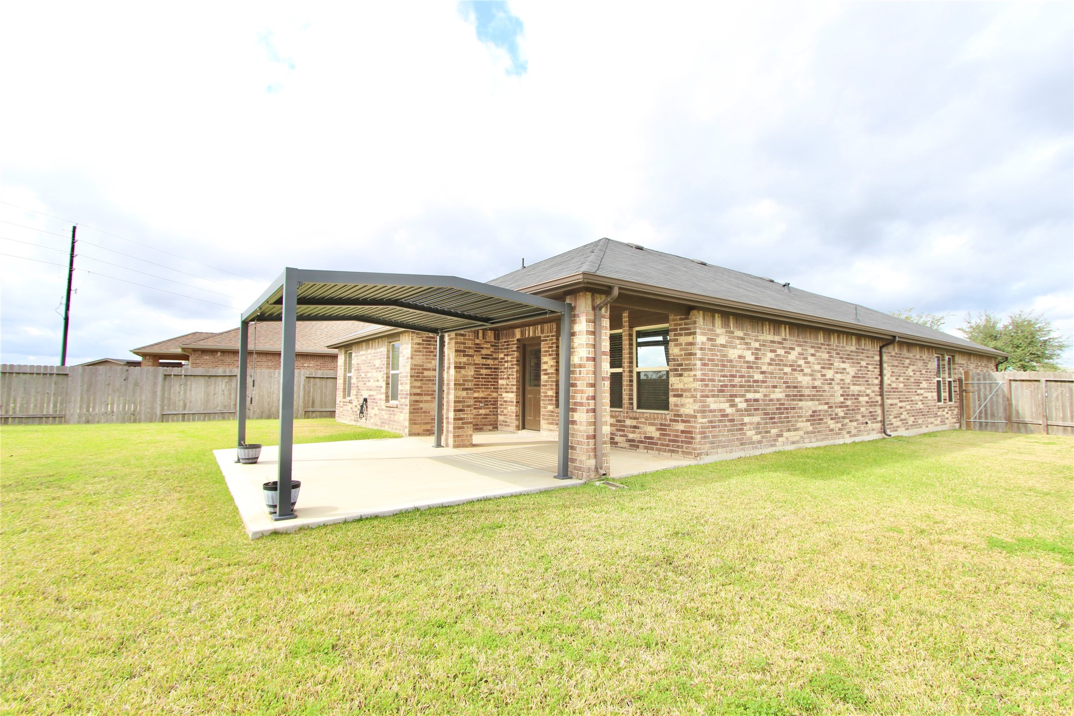 1303 Keaton Court Rosenberg, TX 77469 - Photo 20 of 22 a view of swimming pool with an outdoor space and seating area