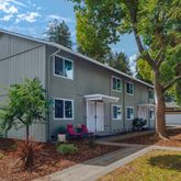 a front view of a house with garden
