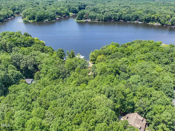 an aerial view of a house with pool and outdoor space