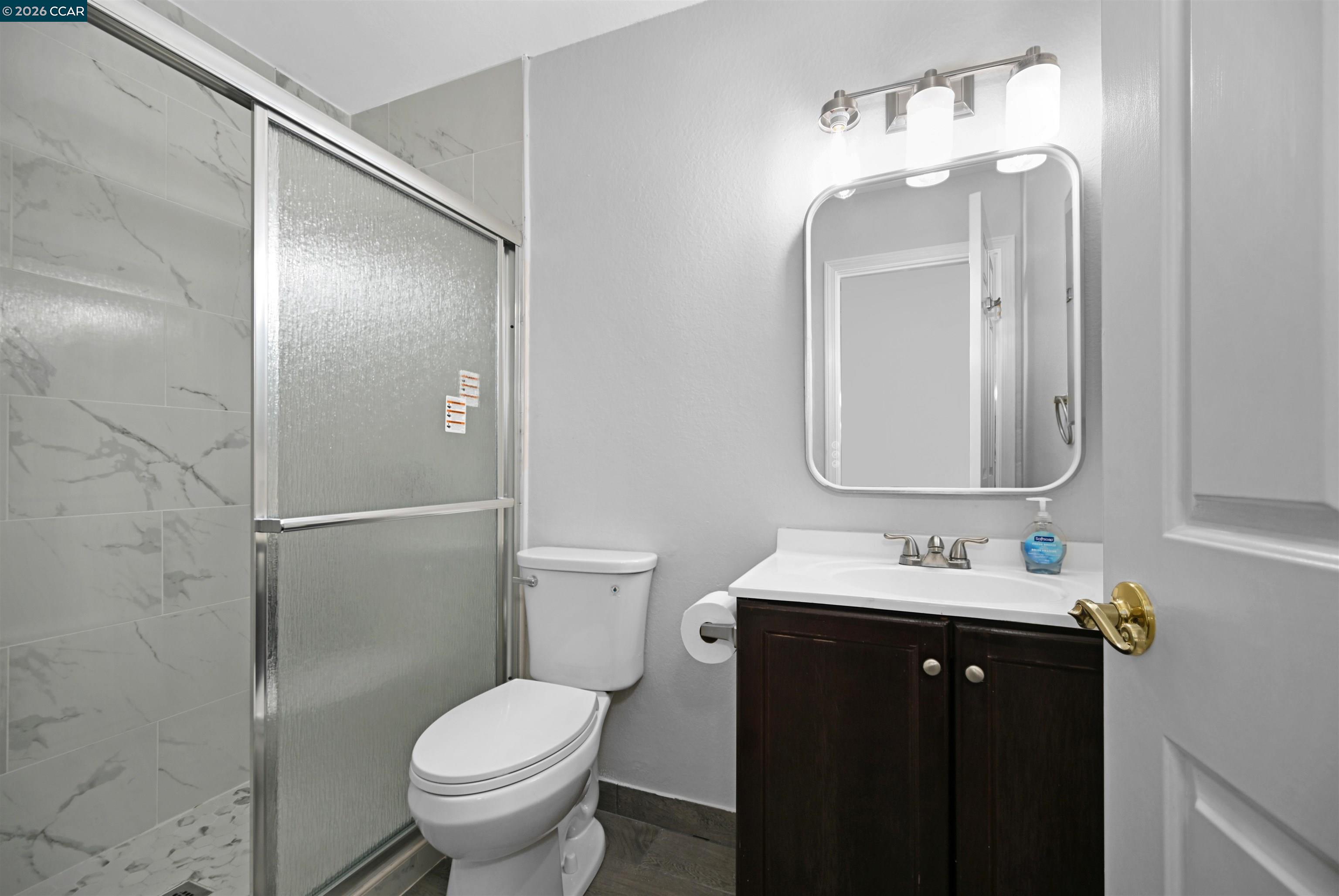 3659 Crow Canyon Road San Ramon, CA 94582 - Photo 22 of 26 a bathroom with a toilet sink and mirror