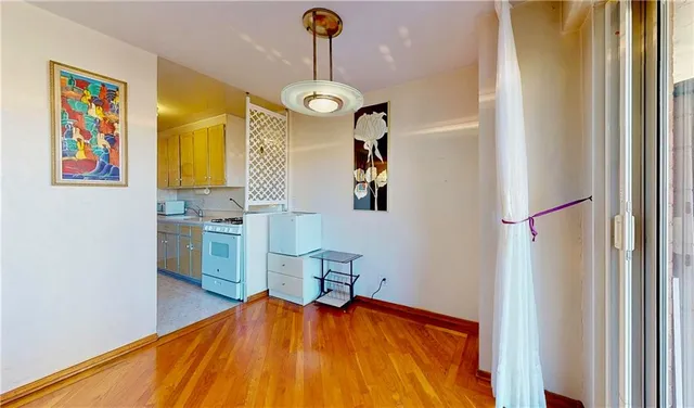 a view of a kitchen with a table and chairs