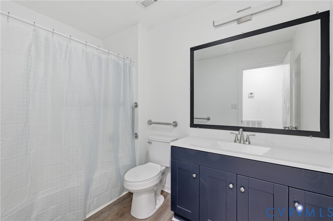 3220 Greenway Road Gladstone, VA 24553 - Photo 16 of 29 a bathroom with a sink a toilet and a mirror