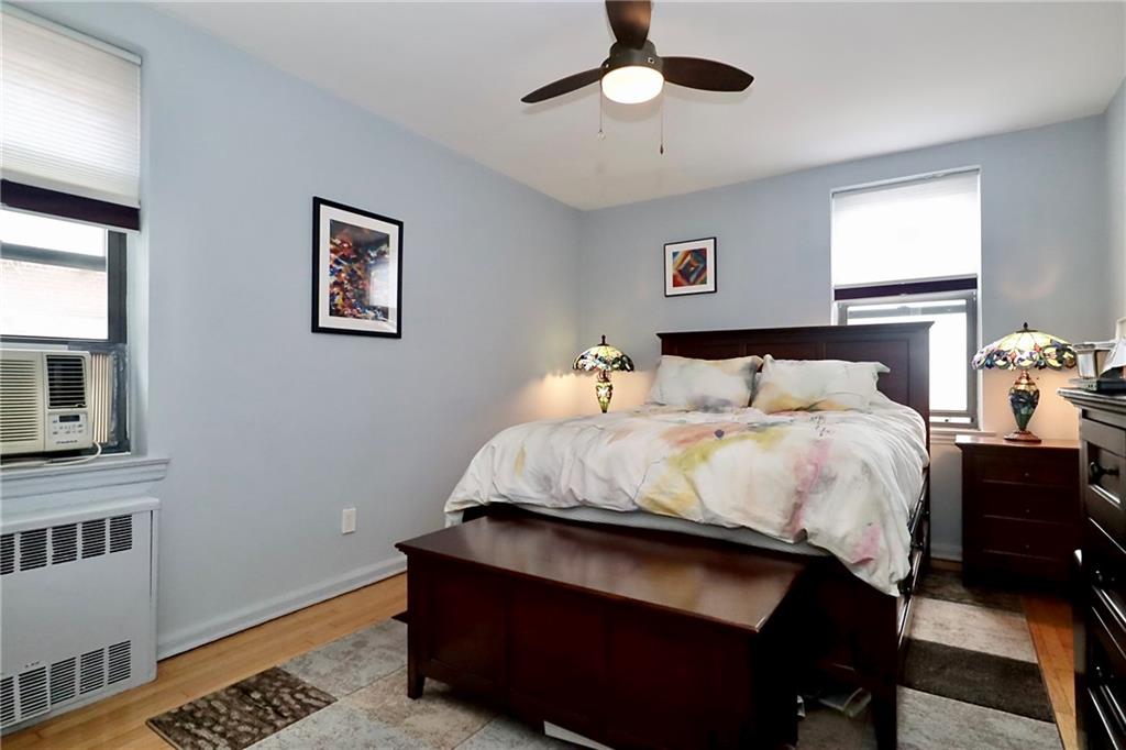 302 96th Street, Unit 3P Brooklyn, NY 11209 - Photo 12 of 19 a bedroom with a bed and a night stand