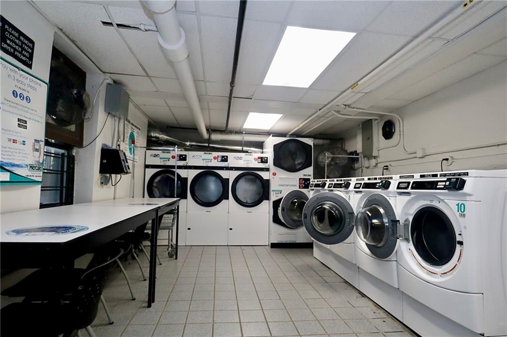 302 96th Street, Unit 3P Brooklyn, NY 11209 - Photo 17 of 19 a utility room with dryer washer and sink