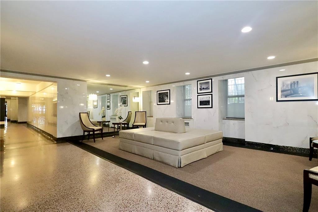 302 96th Street, Unit 3P Brooklyn, NY 11209 - Photo 18 of 19 a spacious bedroom with a bed a couch and large window