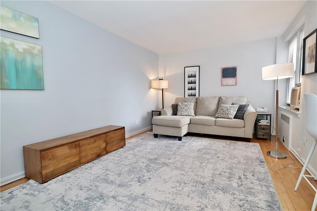 302 96th Street, Unit 3P Brooklyn, NY 11209 - Photo 2 of 19 a living room with furniture and a lamp