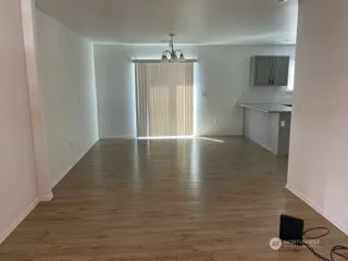a view of a kitchen with a sink and cabinets