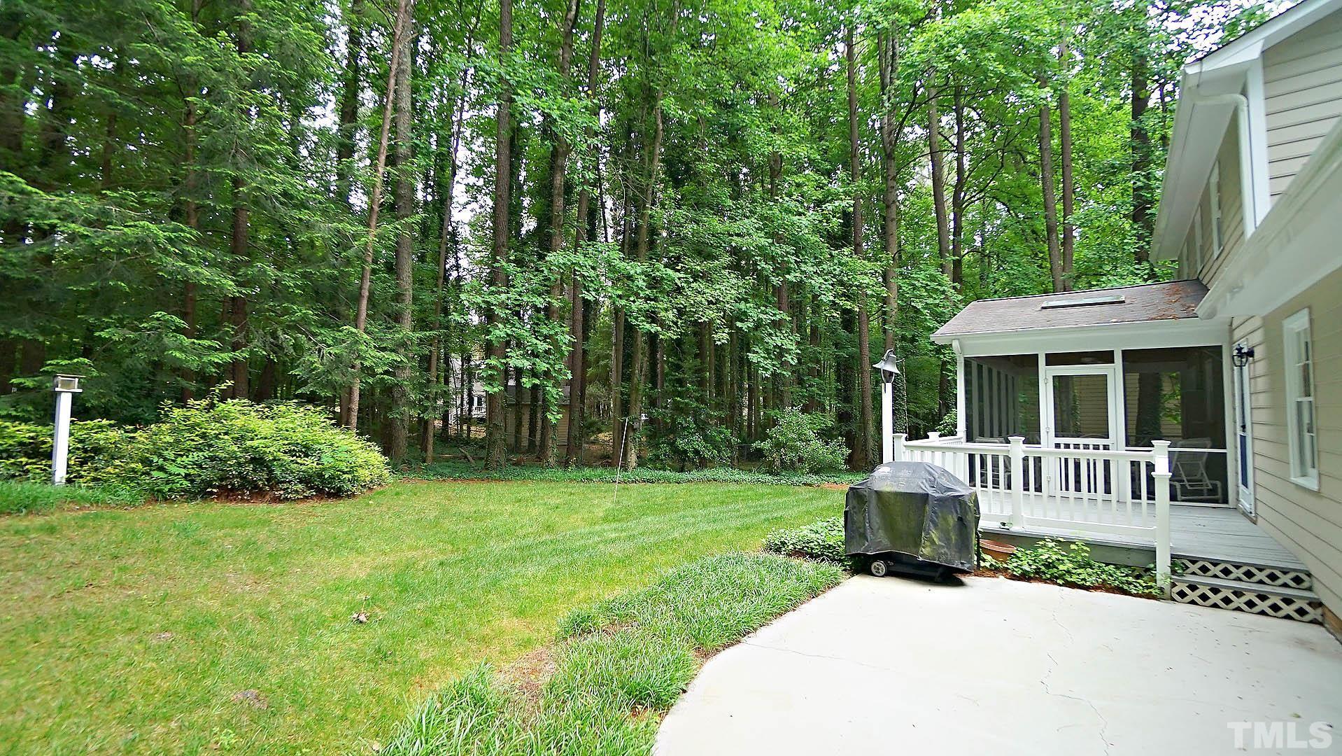 5706 Russell Road Durham, NC 27712 - Photo 7 of 20 a view of a house with backyard and porch