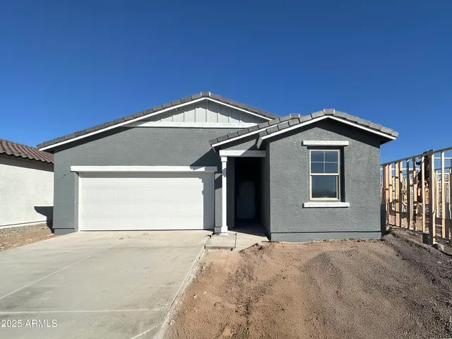 a front view of a house with a garage