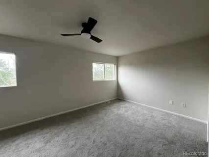 a view of an empty room and a window