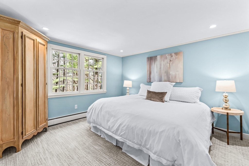 22 Chadwick Road Weston, MA 02493 - Photo 19 of 33 a bedroom with a large bed and a large window