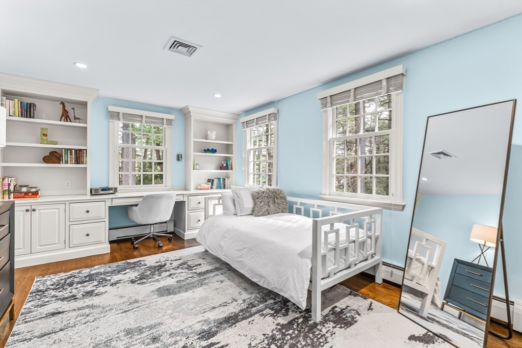 22 Chadwick Road Weston, MA 02493 - Photo 20 of 33 a bedroom with furniture and a window