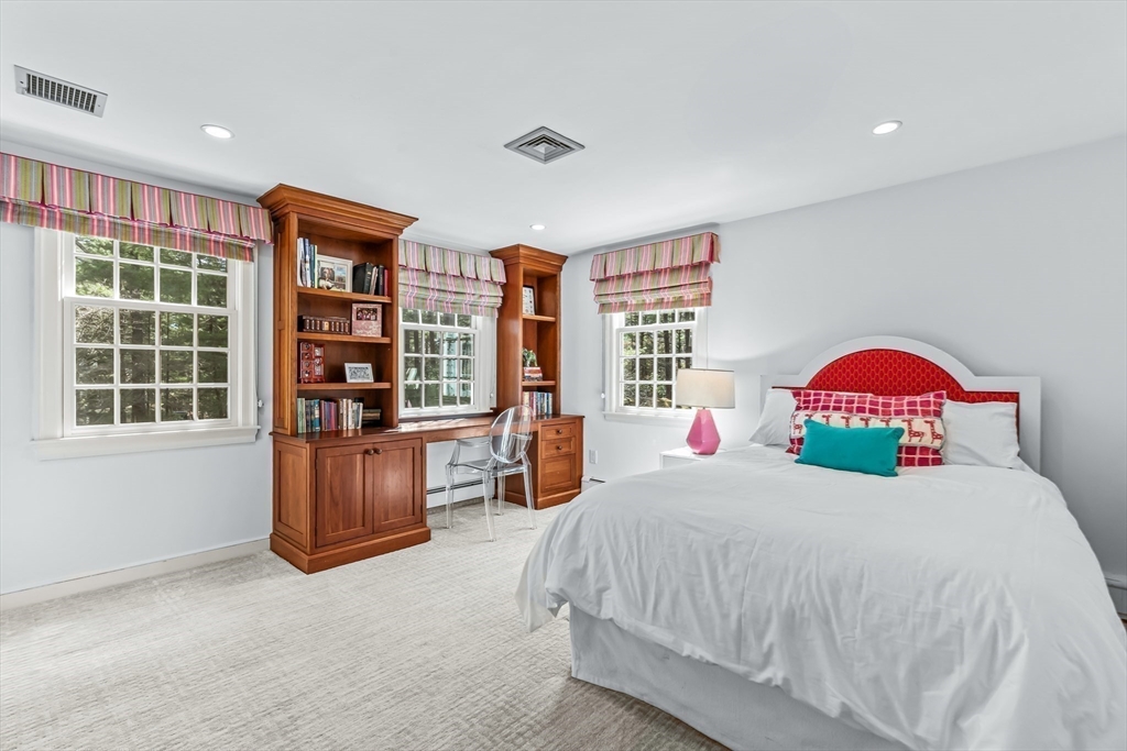 22 Chadwick Road Weston, MA 02493 - Photo 21 of 33 a bedroom with a large bed and a window