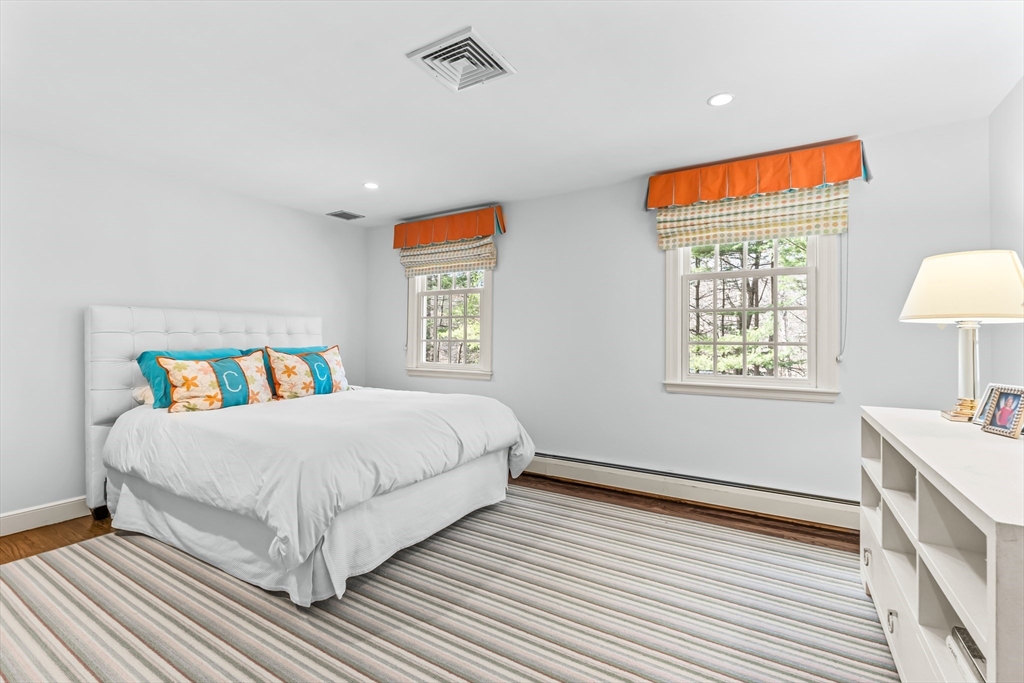 22 Chadwick Road Weston, MA 02493 - Photo 22 of 33 a bedroom with a bed and a table