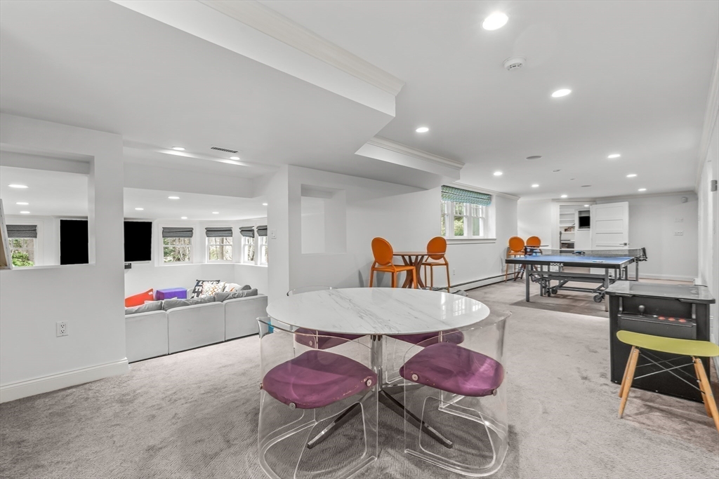 22 Chadwick Road Weston, MA 02493 - Photo 24 of 33 a living room with furniture and kitchen view