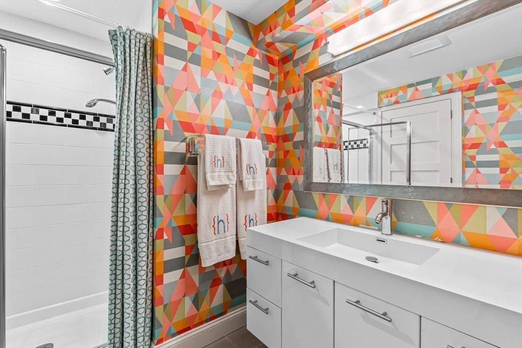 22 Chadwick Road Weston, MA 02493 - Photo 27 of 33 a bathroom with a sink and a shower curtain