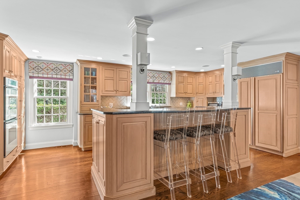 22 Chadwick Road Weston, MA 02493 - Photo 7 of 33 a view of a kitchen with granite countertop wooden floor and windows