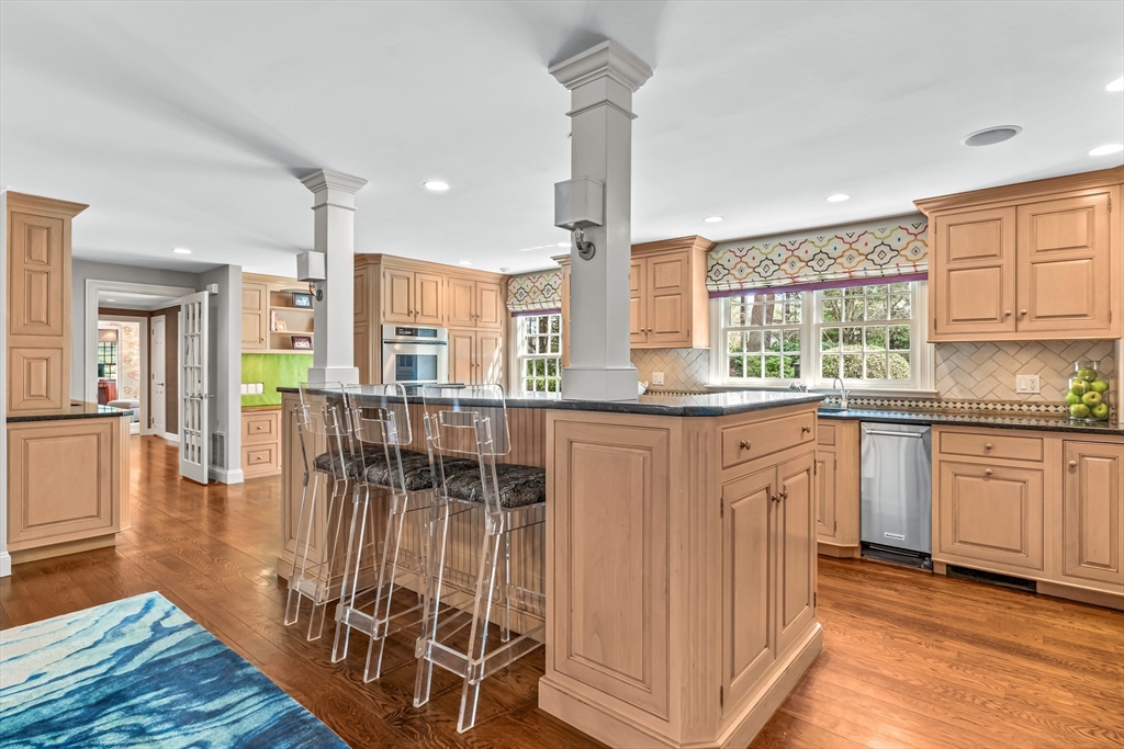 22 Chadwick Road Weston, MA 02493 - Photo 8 of 33 a kitchen with stainless steel appliances granite countertop a stove a sink and a refrigerator