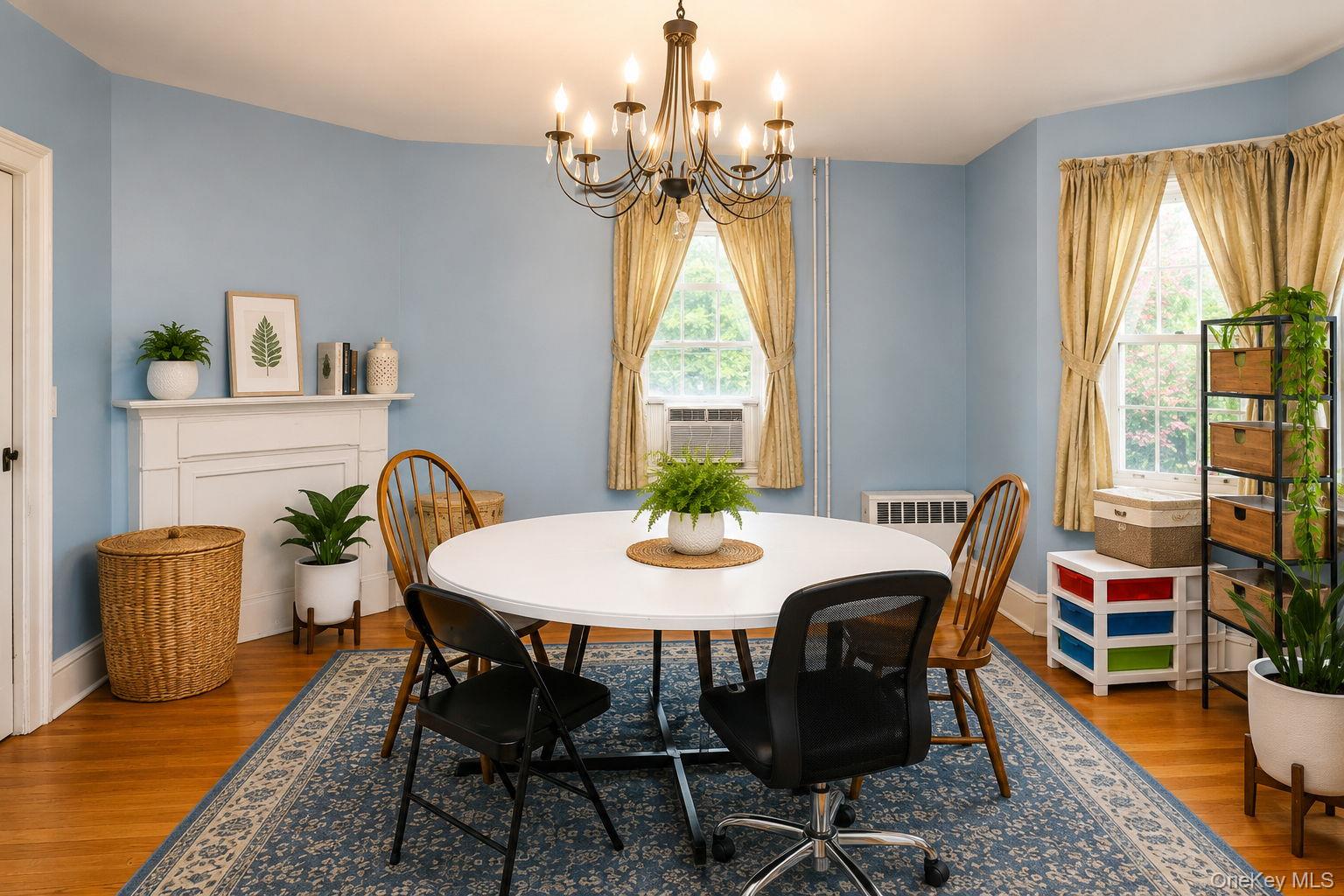 340 Dunn Road Montgomery, NY 12549 - Photo 14 of 34 Formal dinning room with view of decorative wood mantel and wood floors and window ac unit