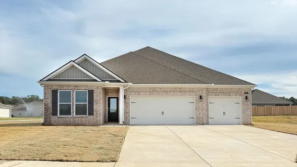 a view of house and garage