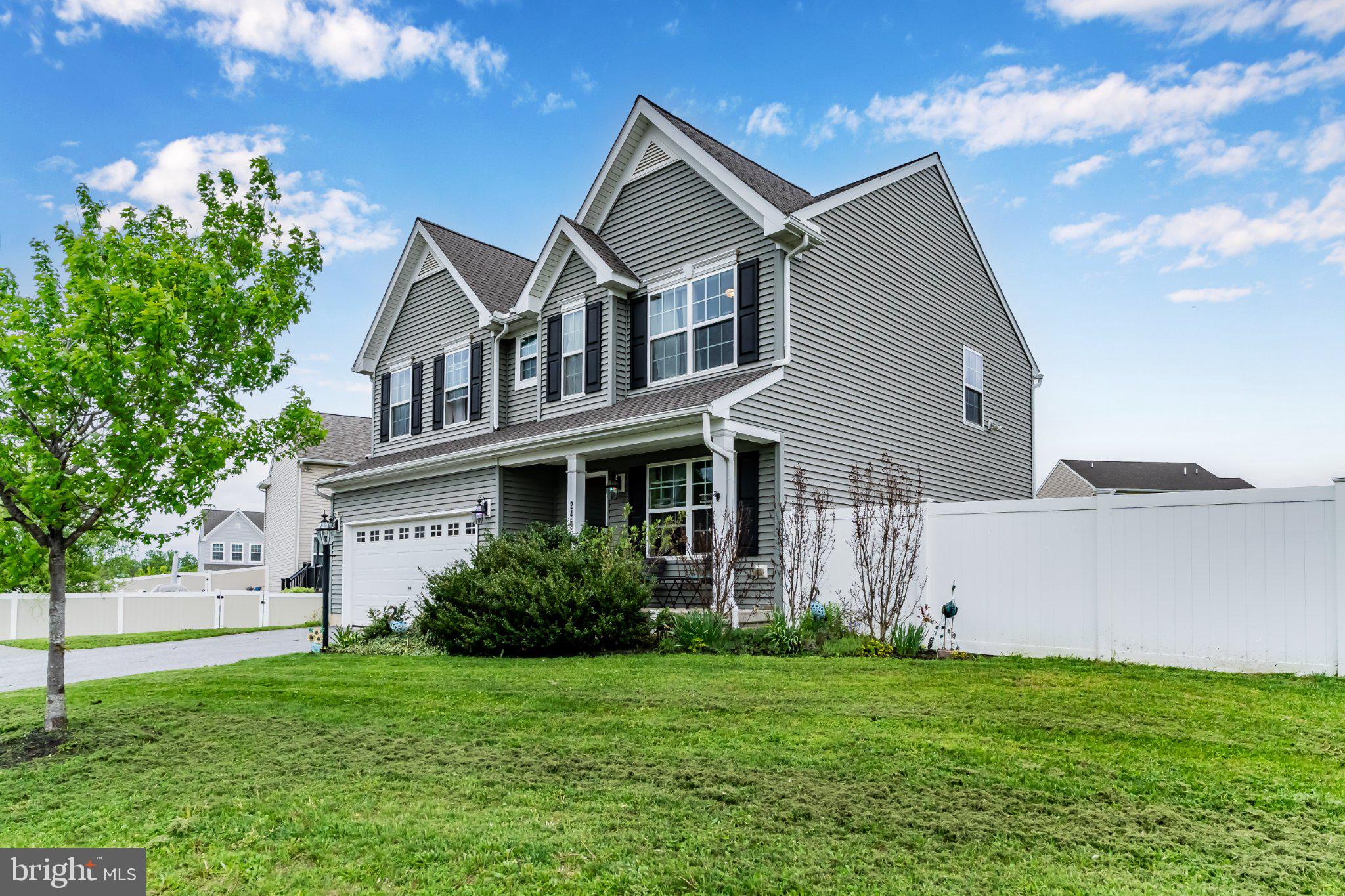 245 Spring Meadows Road Manchester, PA 17345 - Photo 2 of 33 Charming home with lush green lawn.