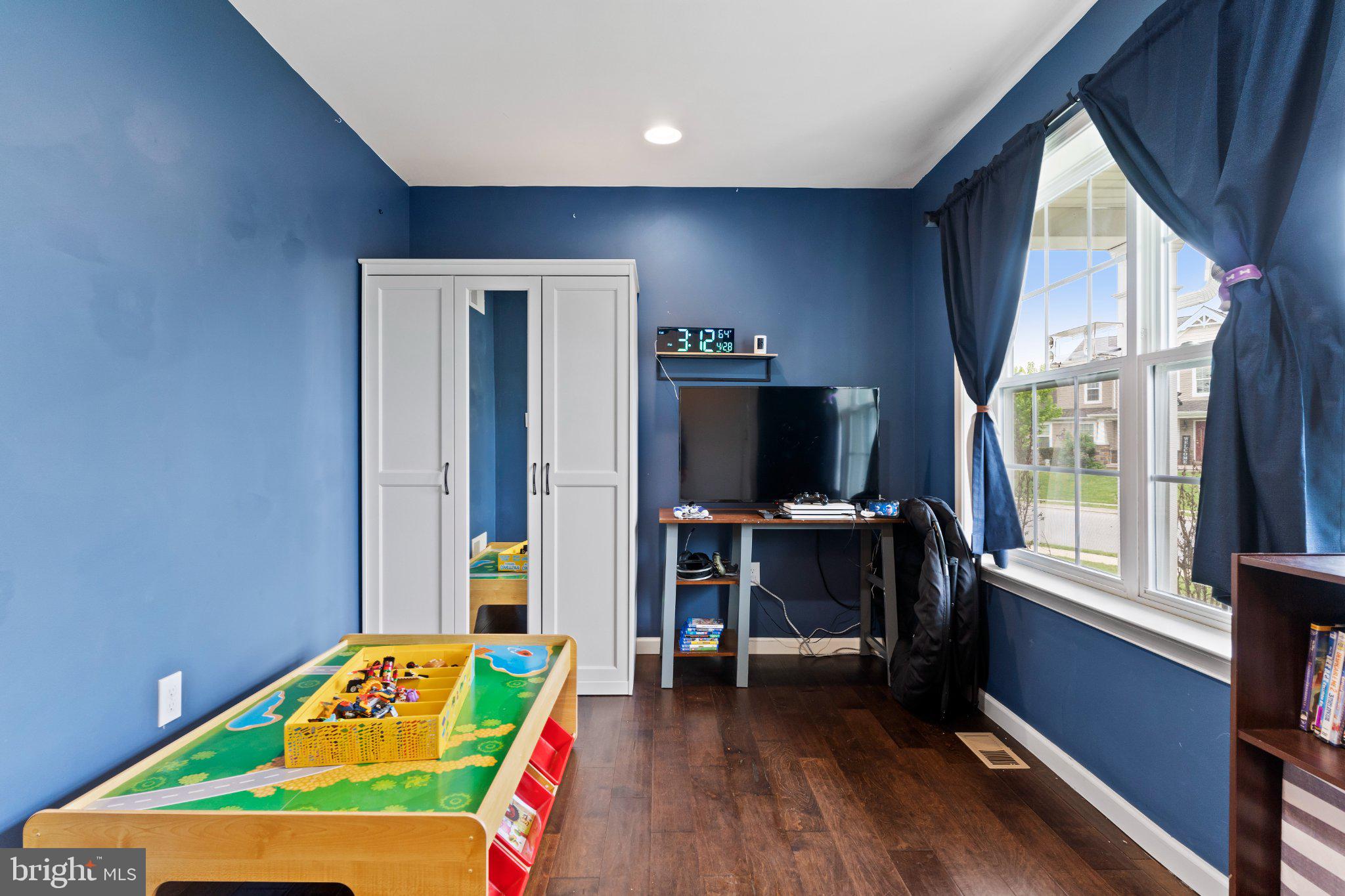 245 Spring Meadows Road Manchester, PA 17345 - Photo 6 of 33 Bright blue walls in a playful room.