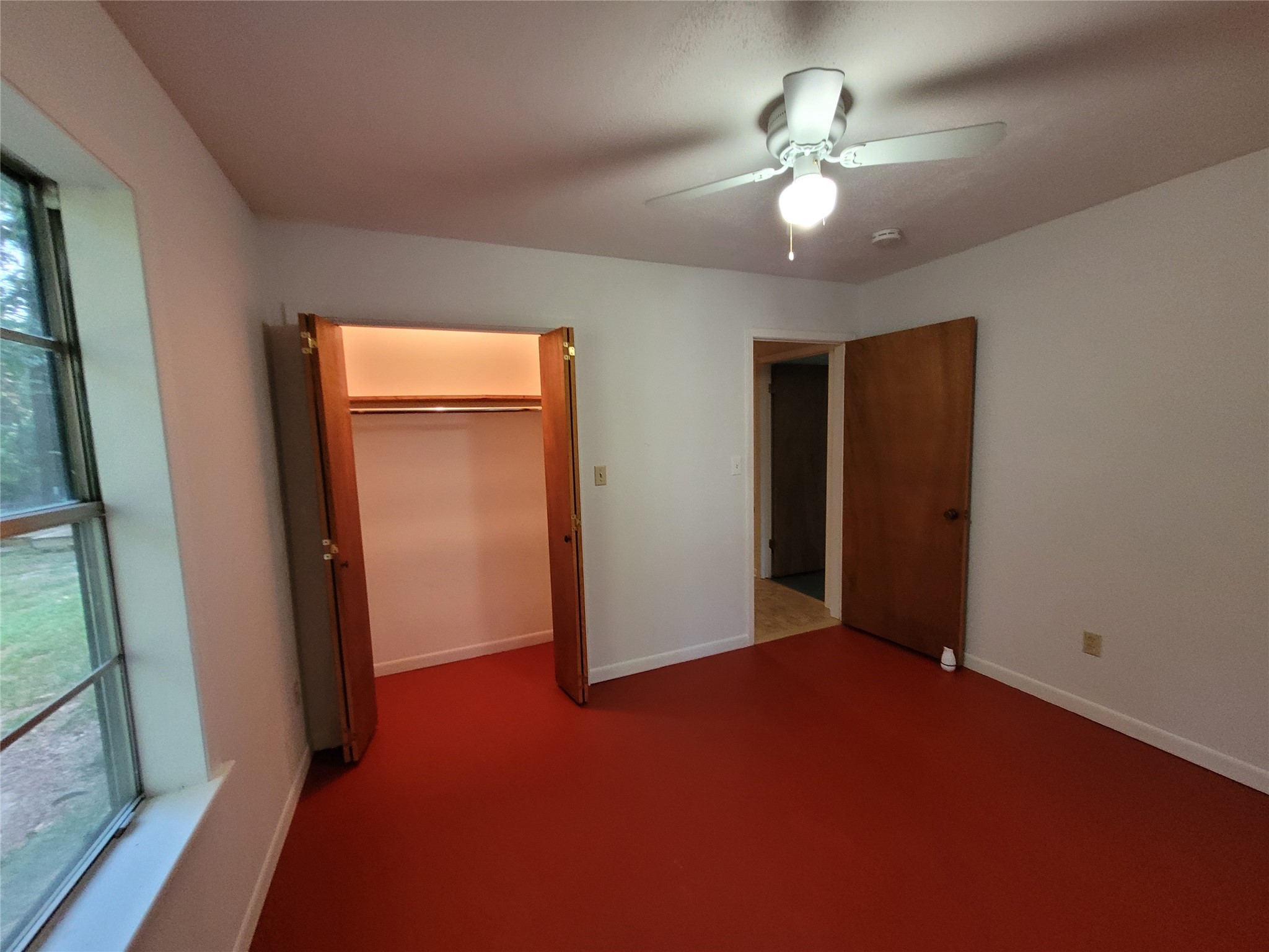 16 Connor Lane Huntsville, TX 77320 - Photo 18 of 33 Secondary bedroom looking to the closet.