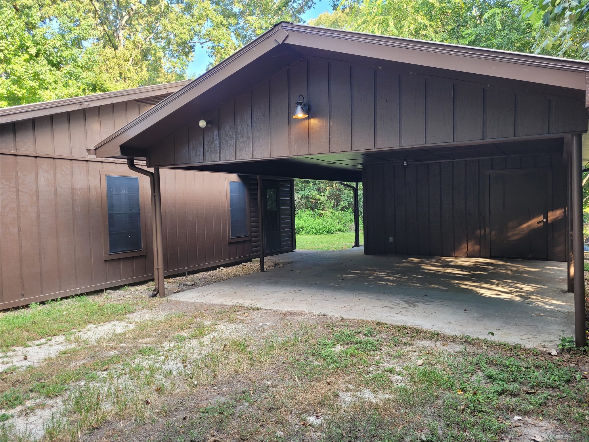 16 Connor Lane Huntsville, TX 77320 - Photo 20 of 33 2 car carport with storage/workshop behind.