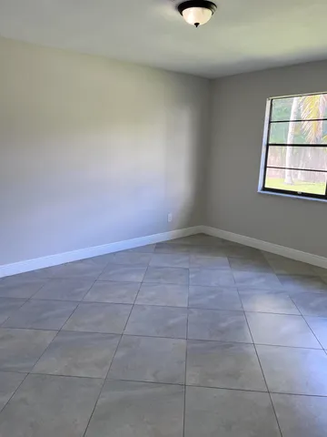 a kitchen with a sink a stove and cabinets