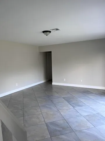 an empty room with a empty space and a window