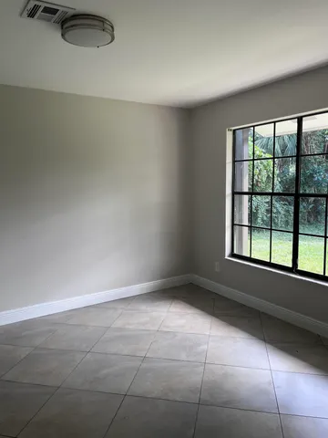 a kitchen with stainless steel appliances granite countertop a sink a stove and a wooden floors