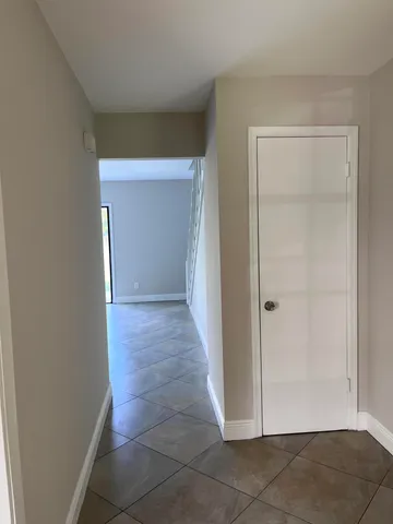 a bathroom with a granite countertop toilet a sink and a shower