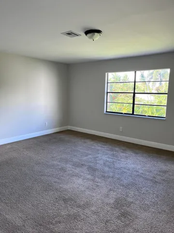 a bathroom with a toilet sink and shower