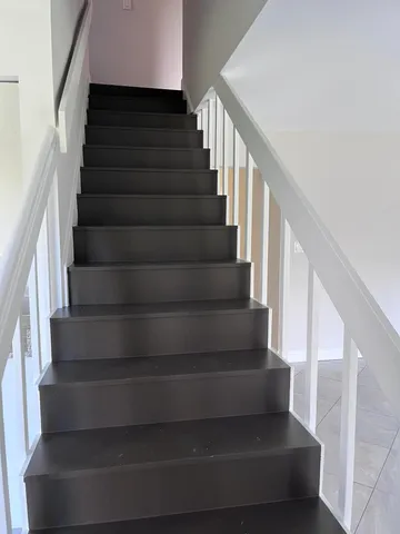 a view of a garage with stairs