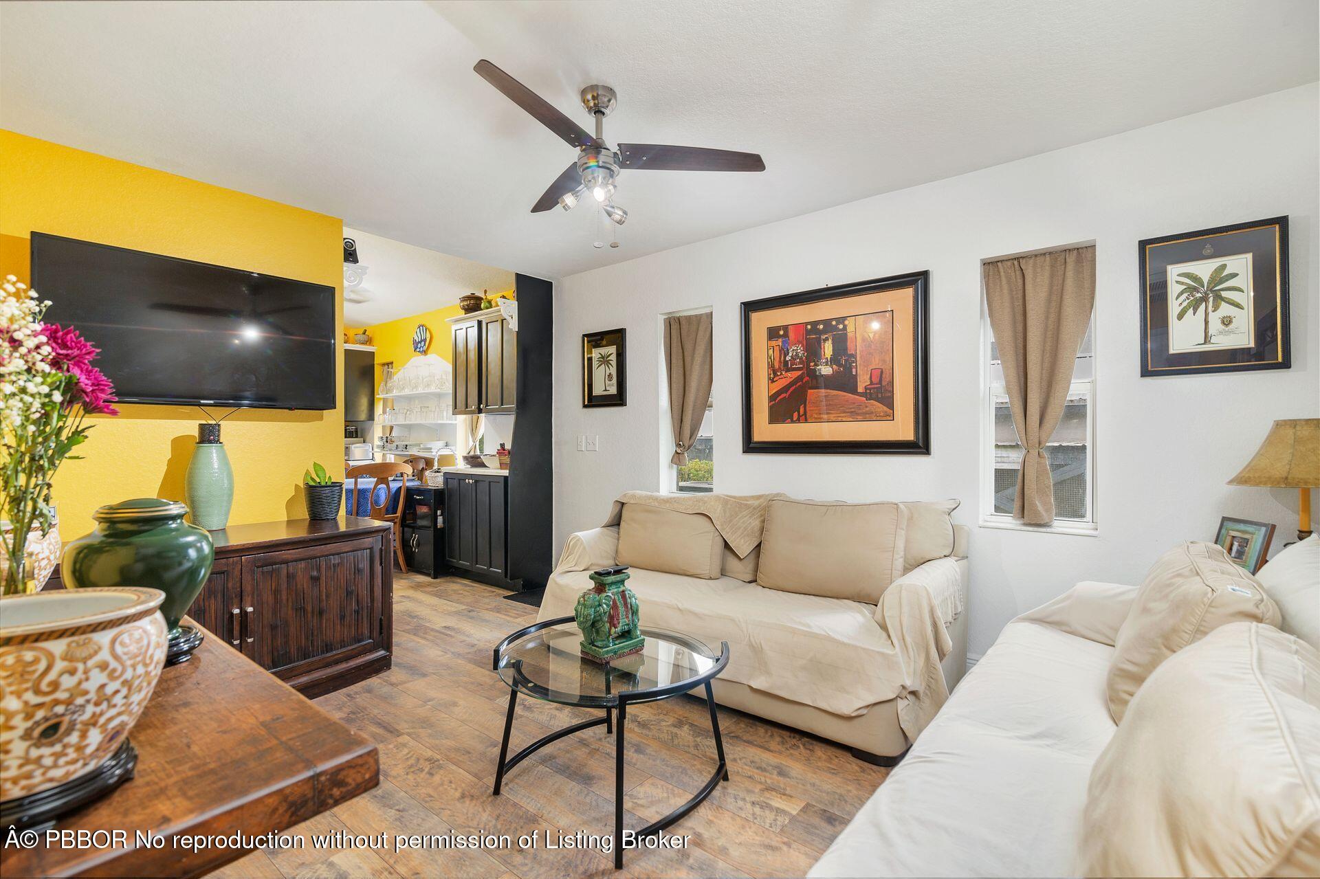 2770 E Road Loxahatchee, FL 33470 - Photo 26 of 51 a living room with furniture and a flat screen tv