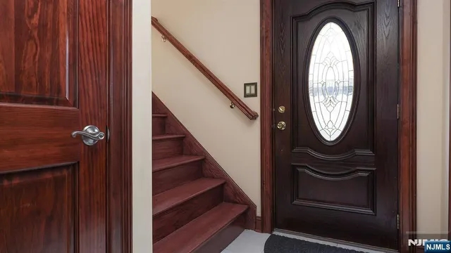 a view of water heater room with washer and dryer