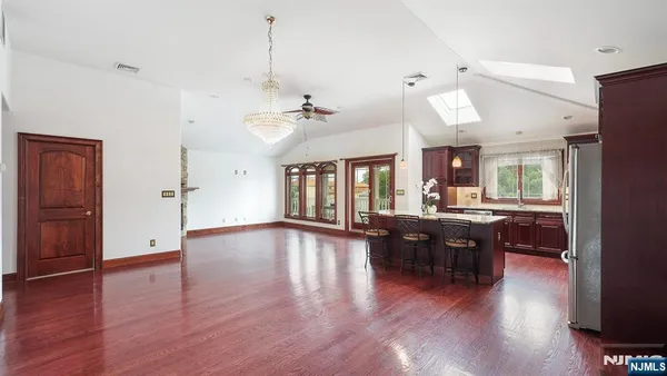 a view of a livingroom with furniture window and wooden floor