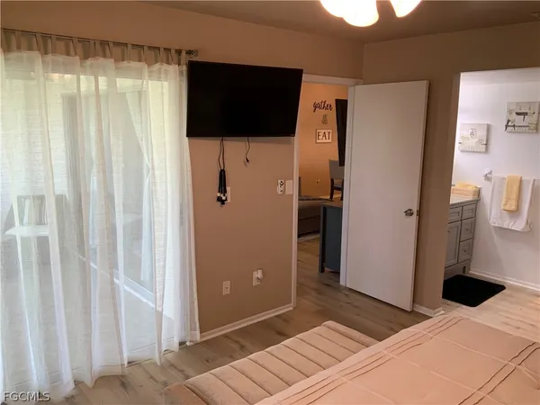 a bedroom with a bed and a view of bathroom