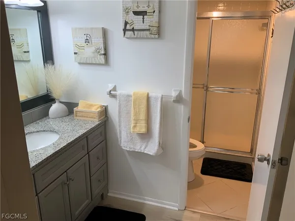 a bathroom with a sink and mirror