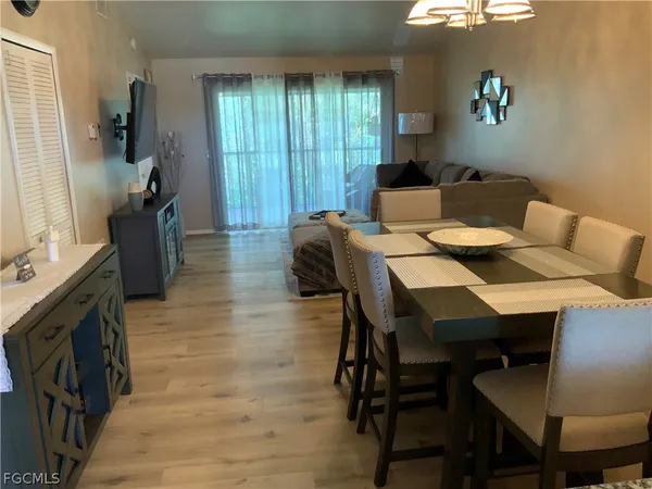 a dining room with furniture and window