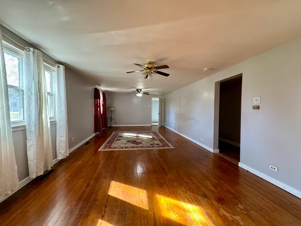 a view of a livingroom with wooden floor