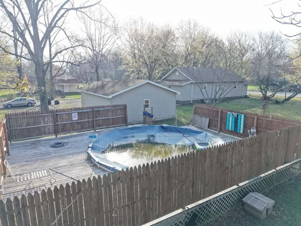 a house with swimming pool in front of it