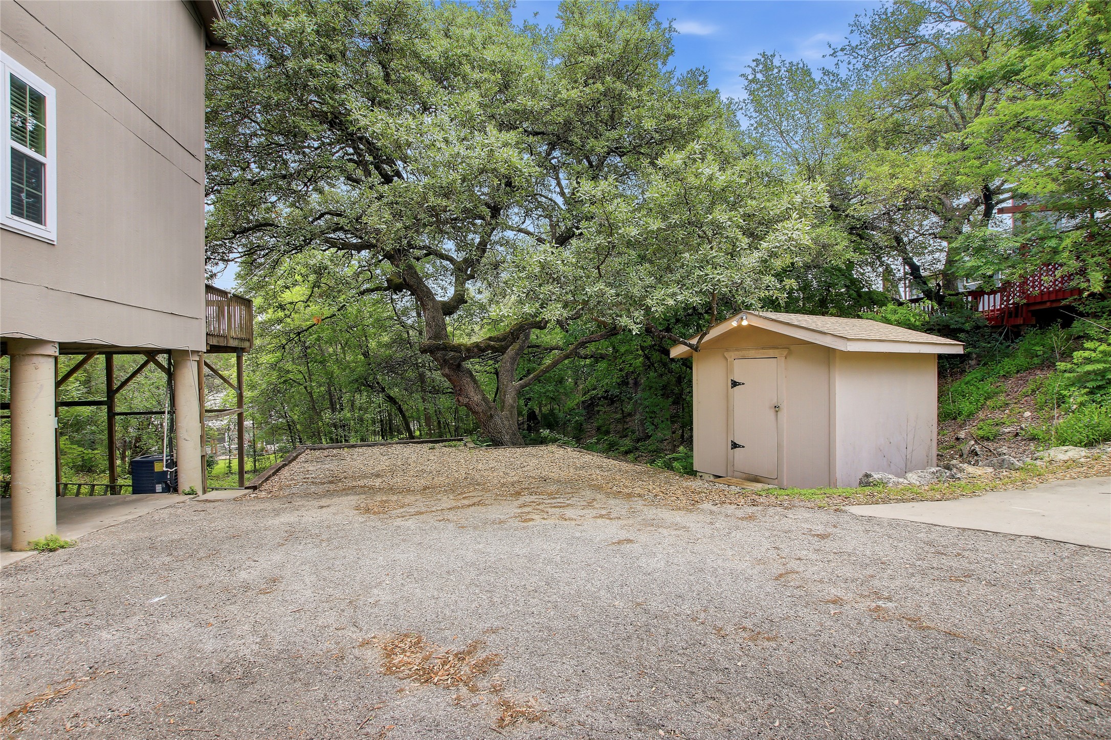 6902 Rifle Bend, Unit B Austin, TX 78736 - Photo 23 of 34 a view of a house with a outdoor space