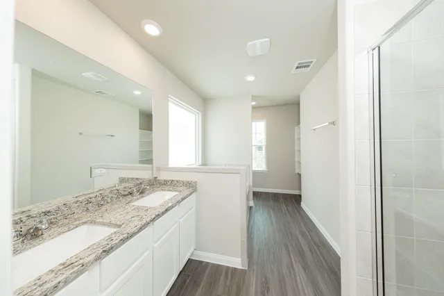 a bathroom with a toilet a sink and bathtub