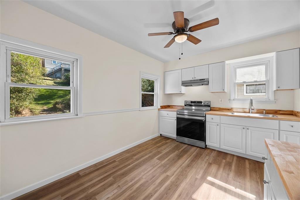 1700 Beaver Road Ambridge, PA 15003 - Photo 15 of 43 a kitchen with a cabinets appliances and a window