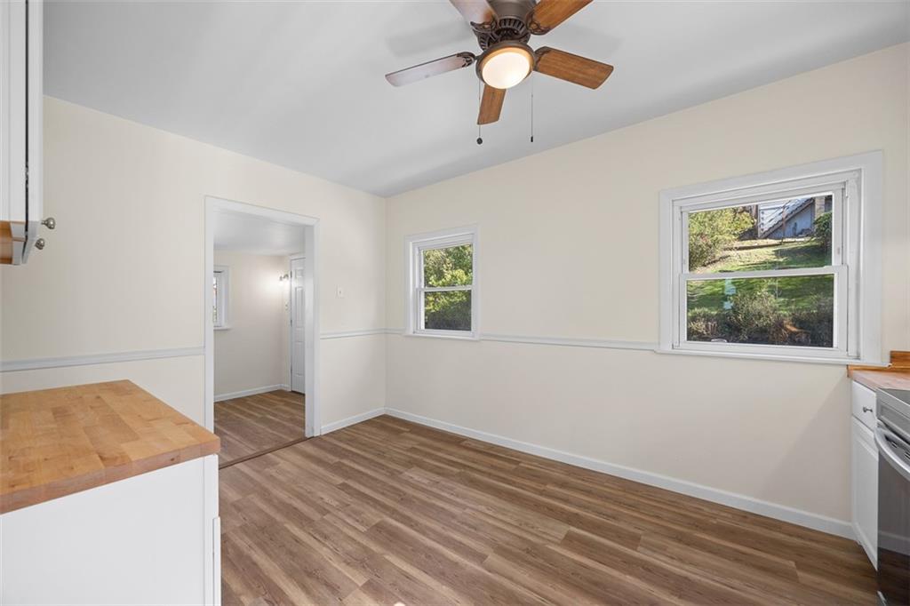 1700 Beaver Road Ambridge, PA 15003 - Photo 16 of 43 wooden floor in an empty room with a window