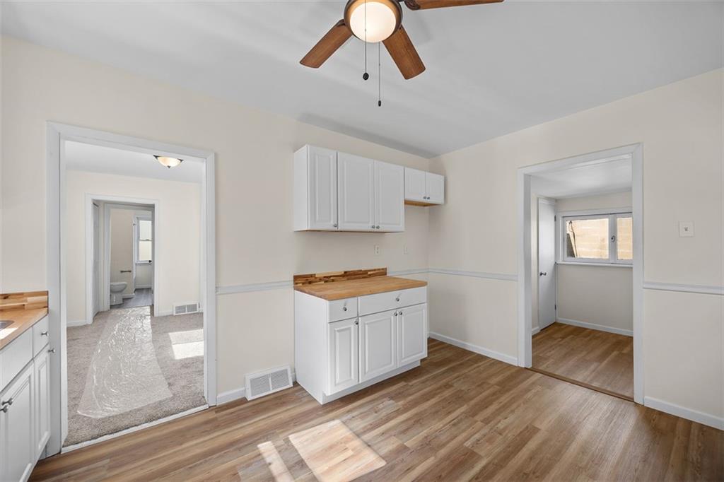 1700 Beaver Road Ambridge, PA 15003 - Photo 17 of 43 a kitchen with granite countertop a stove a sink and a refrigerator