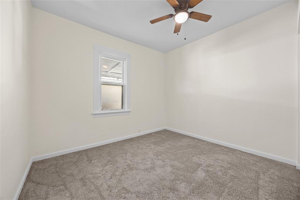 1700 Beaver Road Ambridge, PA 15003 - Photo 19 of 43 an empty room with a window and a fan