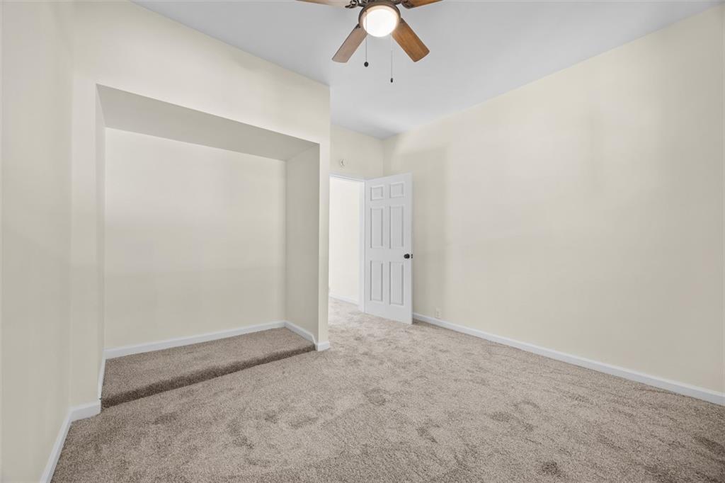 1700 Beaver Road Ambridge, PA 15003 - Photo 20 of 43 an empty room with a ceiling fan and carpet